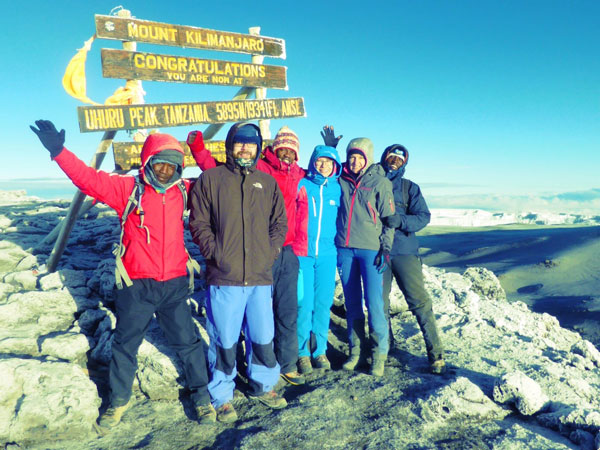 Group hiking kilimanjaro, peak